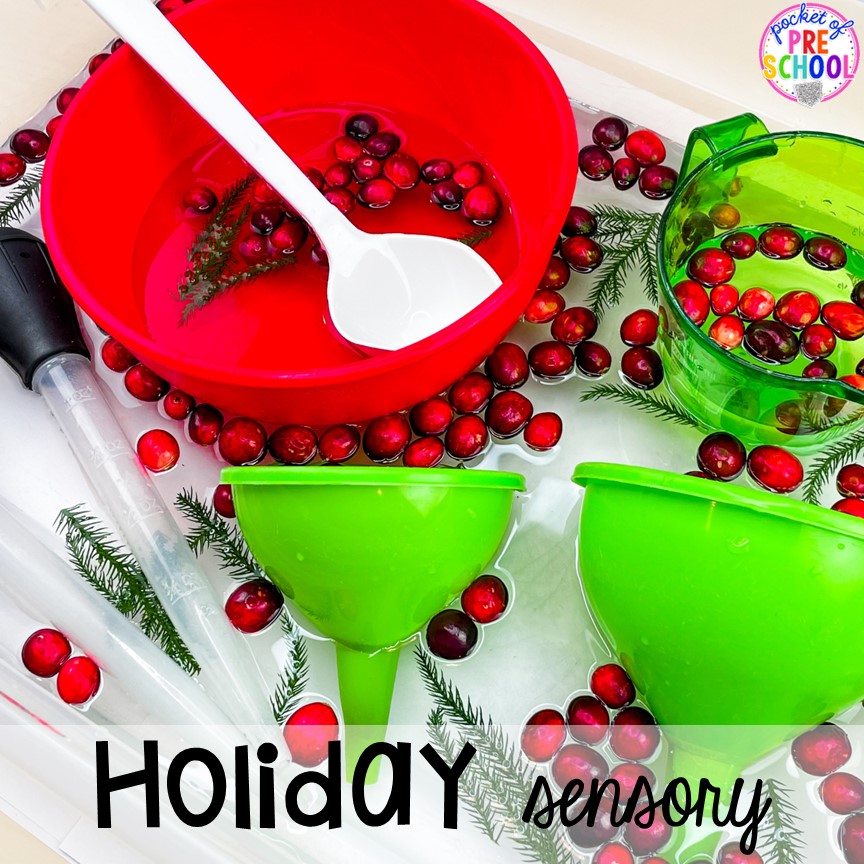 Christmas and holiday sensory table with water, cranberries, and pine tree branches. My go to Christmas themed math, writing, fine motor, sensory, reading, and science activities for preschool and kindergarten.