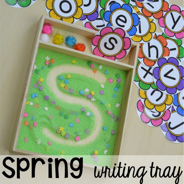 Spring themed writing tray plus Plant Needs and Life Cycle Posters FREEBIE. Prefect for preschool, pre-k, and kindergarten.