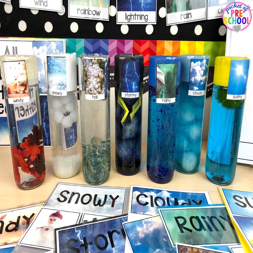 Explore weather at the science table with weatehr sesory bottles and weatehr sorts. 