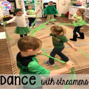Dance with streamers for music and movement. St. Patrick's Day Centers and Activities (math, literacy, writing, sensory, fine motor, art, STEM, blocks, science) and FREE ten frame shamrock cards for preschool, pre-k, and kindergarten.