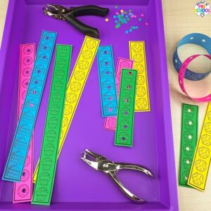Sweets hole punching fine motor activity plus tons more sweets/bakery math and literacy ideas for preschool, pre-k, and kindergarten.
