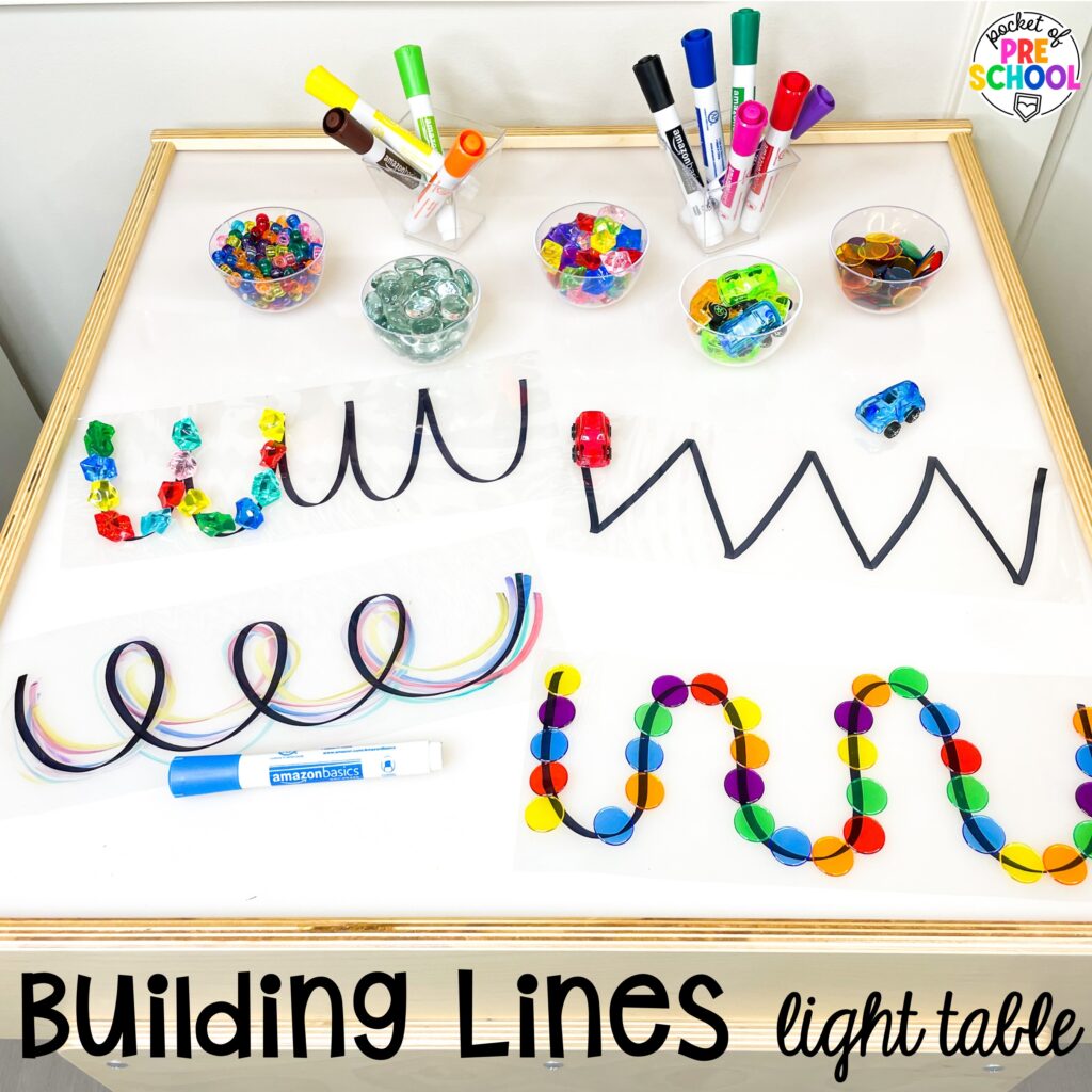 Building lines! Literacy light table ideas for preschool, pre-k, and kindergarten. Plus ideas for fine motor development and pre-writing skills.