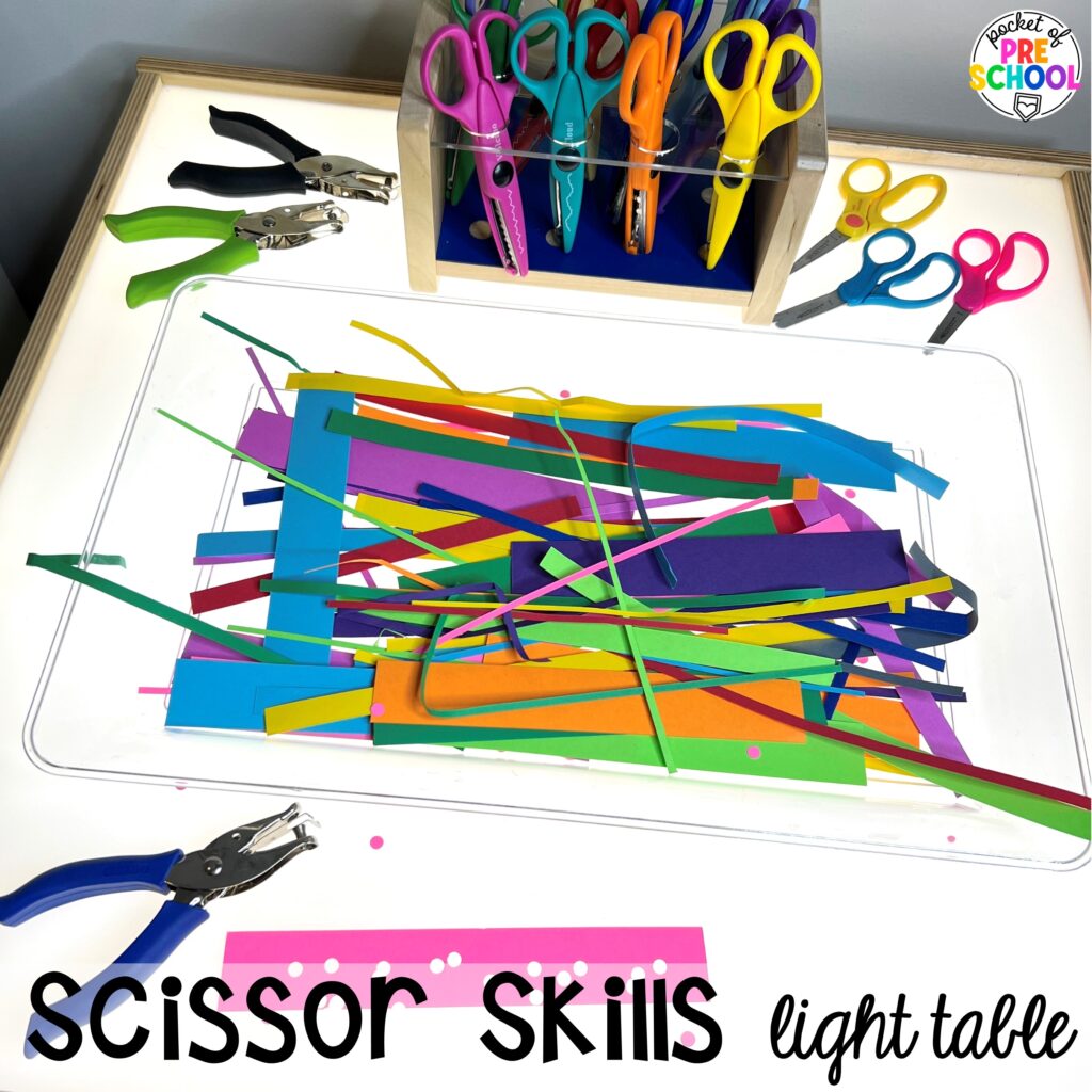 Scissor skills! Literacy light table ideas for preschool, pre-k, and kindergarten. Plus ideas for fine motor development and pre-writing skills.