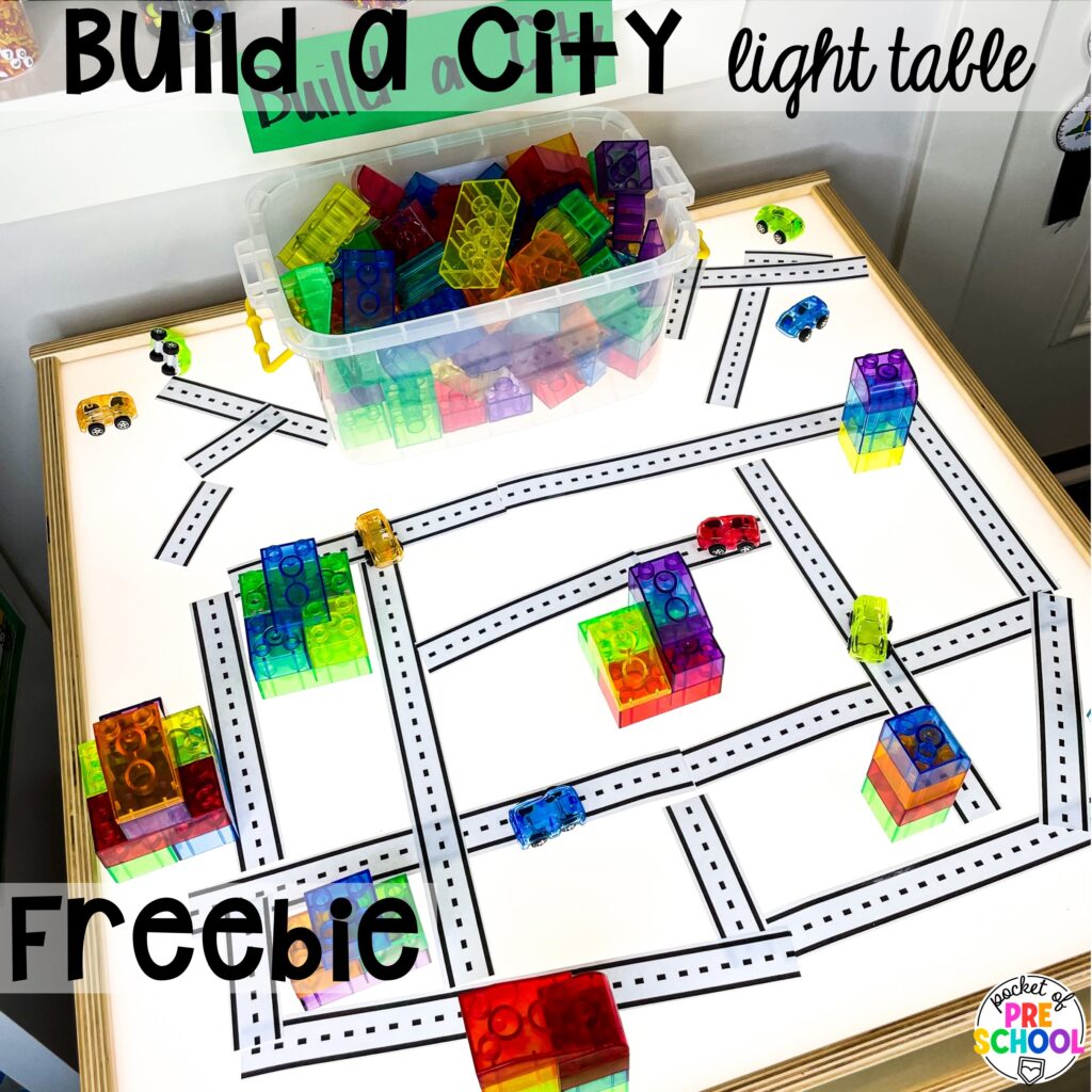 Build a city light table! Build a community with road tape and FREE community signs for the blocks center!